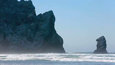 Big rock at Morro Bay in California on sandy beach