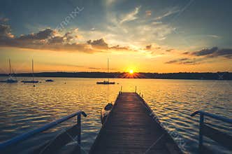 Boats and pier in lake.