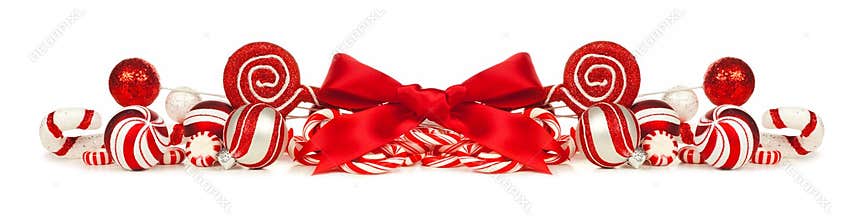 Red and white Christmas baubles, bows and candy cane border