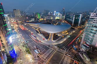 Late night traffic blurs past Dongdaemun Design Plaza,Seoul City