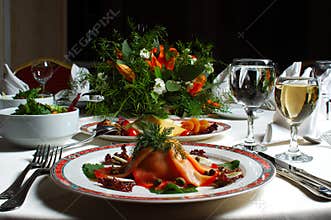 Elegant Dinner Table with Smoked Salmon Appetizer and Wine Glasses