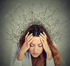 Sad young woman with worried stressed face expression and brain melting into lines