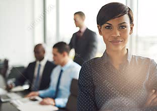 Young business owner in office with employees