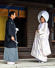 married couple looks at each other with love before a traditional Japan wedding