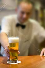 Barman serving beer