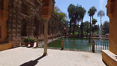 Seville, Andalucia, Spain - April 18, 2016: Alcazar, indoor gardens, courtyards and rooms