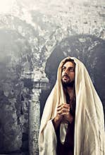 Jesus Christ prays with clasped hands