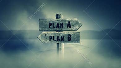 Old Wooden Sign on a Middle of a Cross Road With the Words Plan A or Plan B