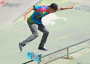 Skater during contest at summer urban festival