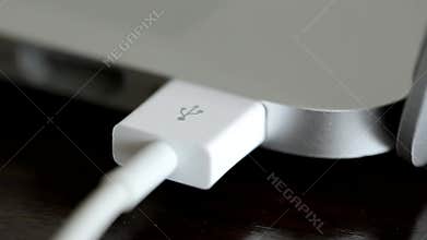 Usb White Cable Connected to a Laptop. Macro Shot