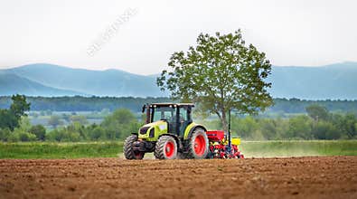 Tractor spraying field.