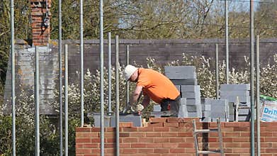 Bricklayer building a new house.