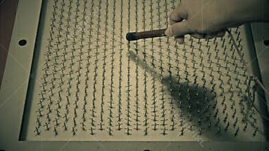 Old raw footage retro film grain of science experiment of scientist testing magnetic field with magnet in HD