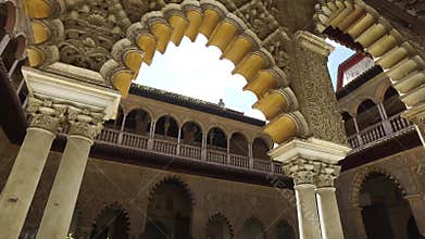 Seville, Andalucia, Spain - April 18, 2016: Alcazar, indoor gardens, courtyards and rooms
