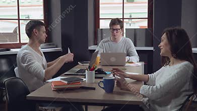 Friends talking at work.