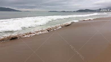 The wave is incident on the sandy beach