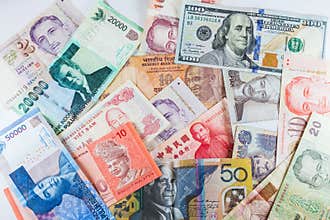 Multiple Currencies banknotes as colorful background