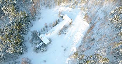 4K Aerial drone footage of an old army bunker located in forest. Winter view.