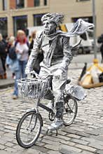 Street artist with a bike