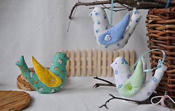 Cute spring birds, decorative toys of handwork. Easter decorations