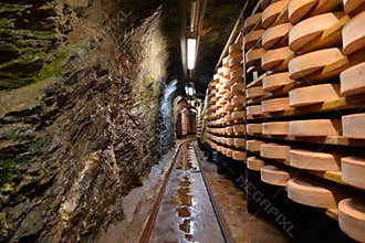 Aosta valley Fontina Italian cheese. Traditional cave aging storage.