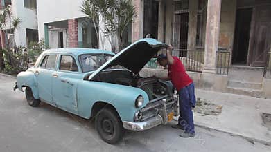 Havana, Cuba, fixing old American car