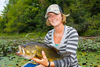 Woman Large Mouth Bass Fishing