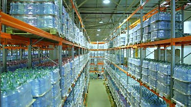 Shelves with boxes of bottled water in warehouse