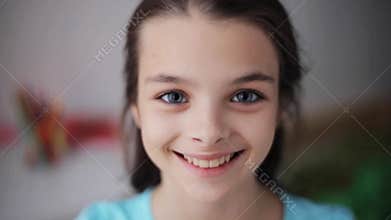 Happy smiling beautiful girl at home