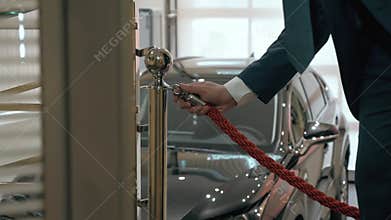 Open a red ribbon. Opening Action of new car showroom