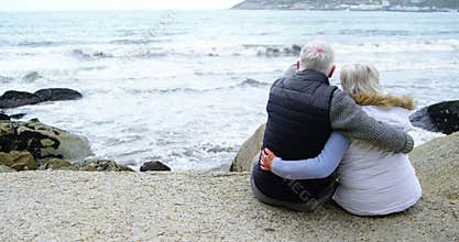 Rear view of senior couple looking at sea
