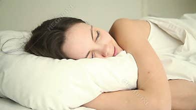 Young woman having good dream