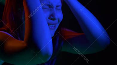 Scared teen girl with in dark