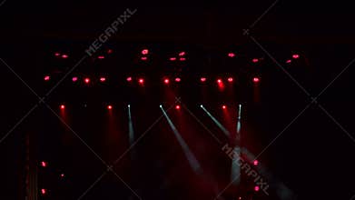 Red stage lights, light show at the concert.