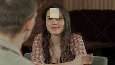 Young company play funny game who I am