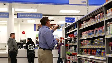 Motion of people buying medicine at pharmacy section