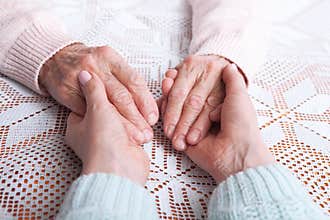 Care is at home of elderly. Senior woman with their caregiver at home. Concept of health care for elderly old people
