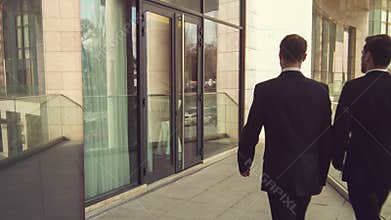 Professioanl businessmen entering the office building