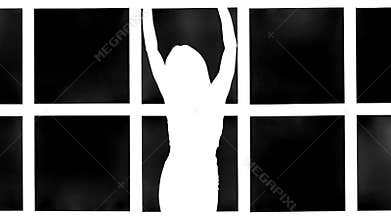 Silhouette of girl with long waving hair in profil on white background with grid window. Slow motion.