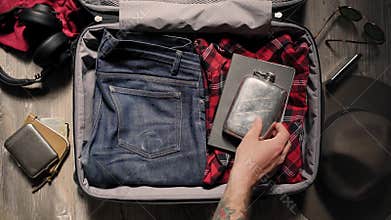 Packing suitcase before adventure travel