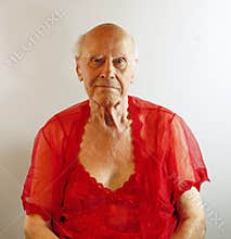 Senior man in red lingerie.