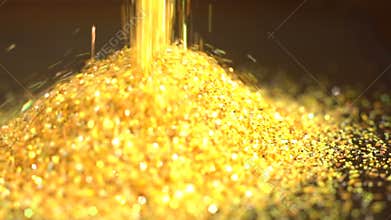 Fallen golden glitter dust. Gold sparkles fall to a pile
