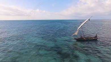 Aerial view of fishermen go out on sailboats to the ocean for fishing. Zanzibar.