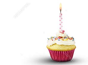 Single cup cake with lit pink spotted candle isolated on white b