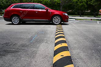 Minivan Driving Over Speed Bump
