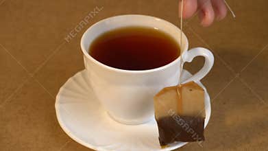 Brew teabag and lemon in Cup of tea