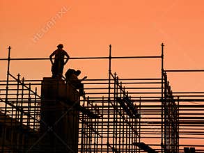 Construction workers on scaffolding