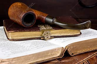 Pipe and books