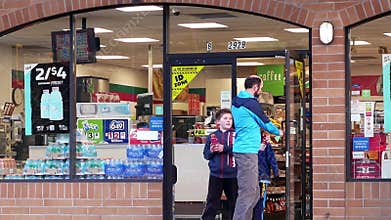 Storefront of people leaving of main entrance