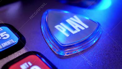 Close up spinning play button on slot machine